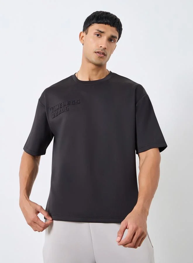 Styli Men Black Oversized Chest Embossed T-Shirt